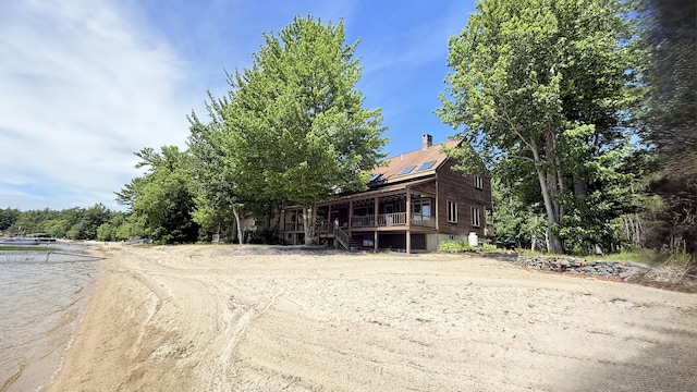 270 Grant Rd, Sullivan, ME 04664 - view of front of house featuring stairs, driveway, and a deck