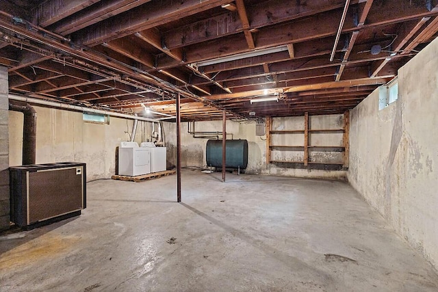 329 Reed Rd, Windsor, ME 04363 - unfinished basement featuring washing machine and clothes dryer and oil tank
