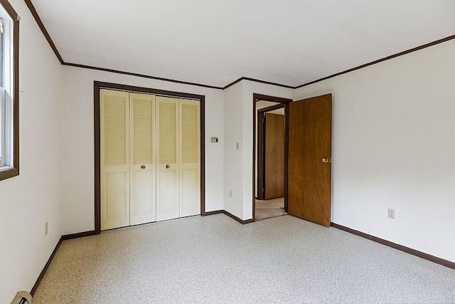 329 Reed Rd, Windsor, ME 04363 - unfurnished bedroom featuring ornamental molding, a closet, and a baseboard radiator