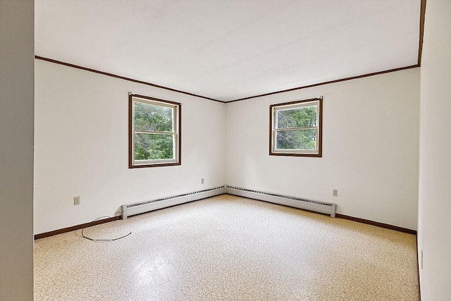329 Reed Rd, Windsor, ME 04363 - unfurnished room with plenty of natural light, crown molding, and a baseboard heating unit