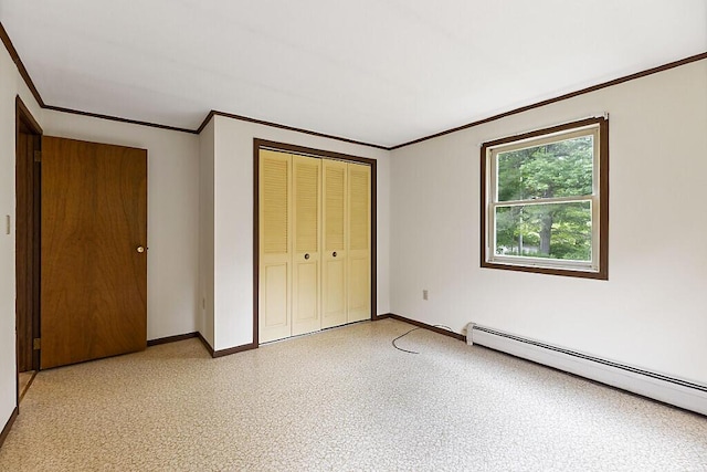329 Reed Rd, Windsor, ME 04363 - unfurnished bedroom featuring baseboard heating, ornamental molding, and a closet