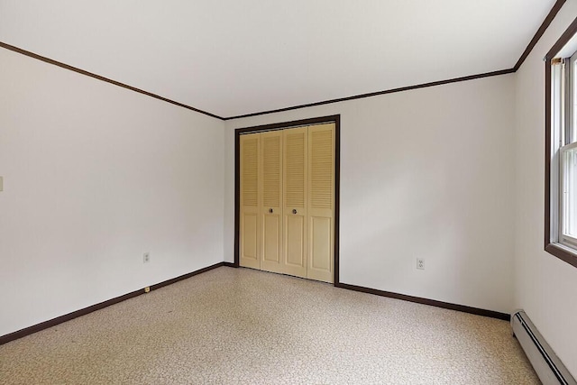 329 Reed Rd, Windsor, ME 04363 - unfurnished bedroom with a baseboard heating unit, ornamental molding, and a closet