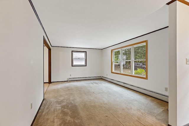 329 Reed Rd, Windsor, ME 04363 - unfurnished room featuring carpet floors, a baseboard radiator, and crown molding