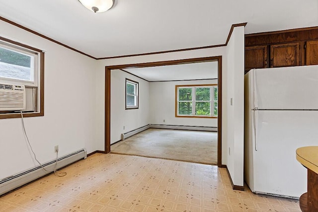329 Reed Rd, Windsor, ME 04363 - kitchen featuring freestanding refrigerator, baseboard heating, ornamental molding, light flooring, and dark brown cabinetry
