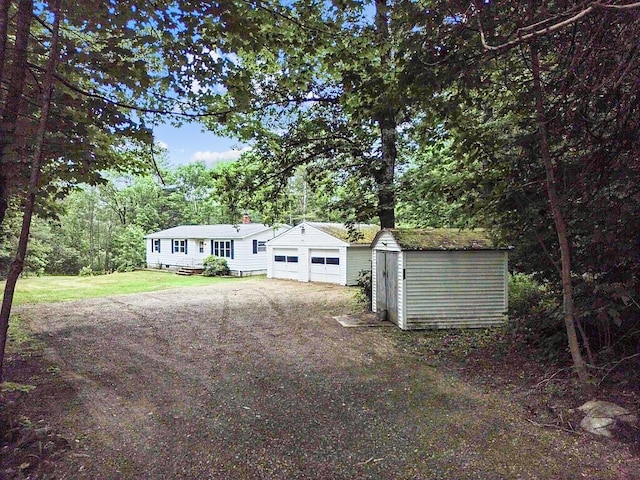 329 Reed Rd, Windsor, ME 04363 - view of front of home featuring a storage shed and a front yard