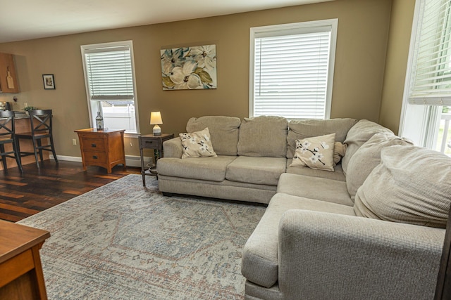 13 Bremen St, Westbrook, ME 04092 - living area featuring dark wood-style flooring and a baseboard heating unit