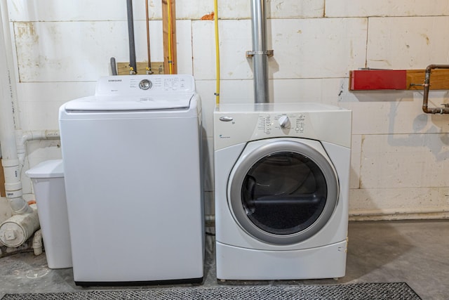 13 Bremen St, Westbrook, ME 04092 - laundry room with washing machine and dryer and concrete block wall