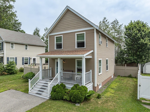 13 Bremen St, Westbrook, ME 04092 - view of front of property featuring a porch, a front yard, and a storage unit