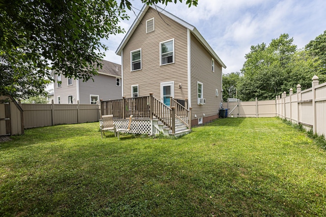 13 Bremen St, Westbrook, ME 04092 - back of property with a fenced backyard and a wooden deck