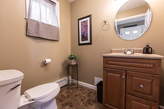 13 Bremen St, Westbrook, ME 04092 - bathroom with vanity, baseboard heating, and tile patterned flooring