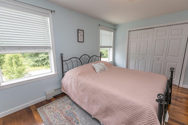 13 Bremen St, Westbrook, ME 04092 - bedroom featuring a closet, wood finished floors, and a baseboard heating unit
