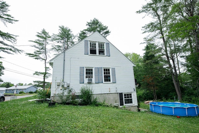17 Duncan Rd, Augusta, ME 04330 - view of property exterior with an outdoor pool and a lawn