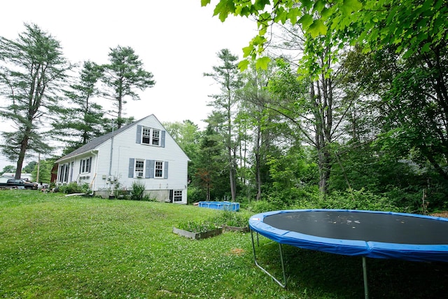 17 Duncan Rd, Augusta, ME 04330 - view of side of home with a trampoline and a yard