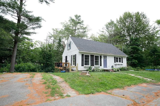 17 Duncan Rd, Augusta, ME 04330 - view of front facade featuring a deck, a shingled roof, a front yard, and driveway