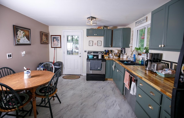 17 Duncan Rd, Augusta, ME 04330 - kitchen with butcher block countertops, appliances with stainless steel finishes, and light marble finish flooring