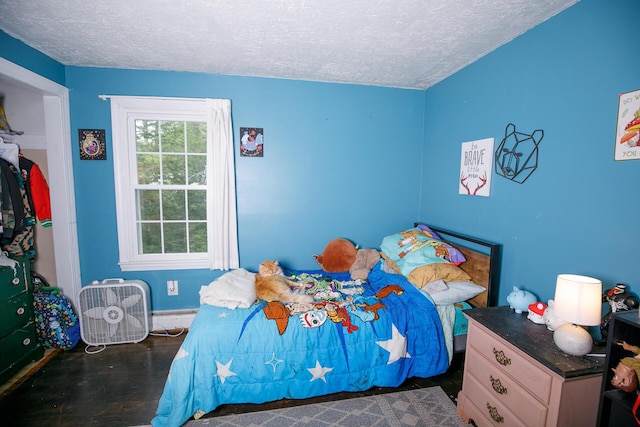 17 Duncan Rd, Augusta, ME 04330 - bedroom with a textured ceiling and wood finished floors