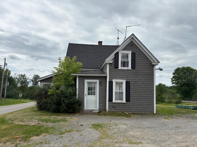 41 S Main St, Burnham, ME 04922 - view of front of house featuring roof with shingles and a chimney