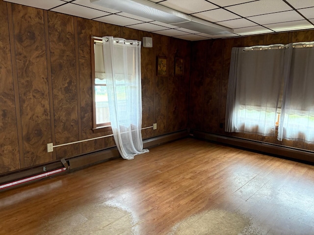 41 S Main St, Burnham, ME 04922 - empty room featuring wood finished floors and wooden walls