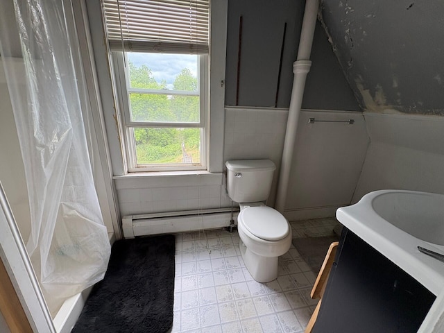 41 S Main St, Burnham, ME 04922 - bathroom featuring a baseboard radiator, vanity, curtained shower, and tile walls