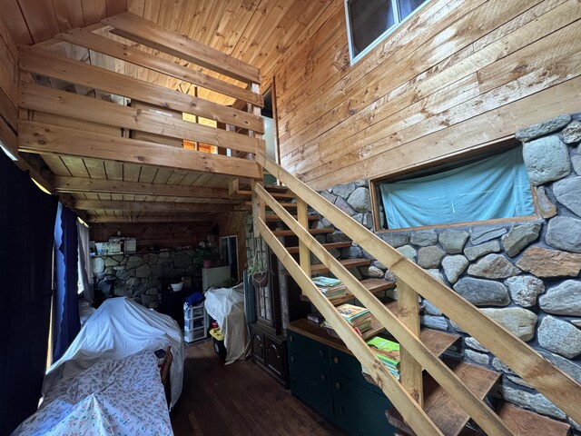 1698 Exeter Rd, Exeter, ME 04435 - bedroom featuring wooden walls, wood ceiling, hardwood / wood-style flooring, and lofted ceiling