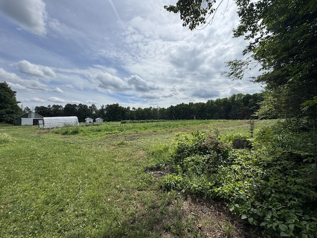 1698 Exeter Rd, Exeter, ME 04435 - view of yard with a rural view, a pole building, and an outbuilding