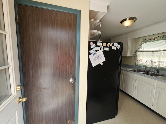 381 Birch St, Bangor, ME 04401 - kitchen featuring freestanding refrigerator and white cabinetry