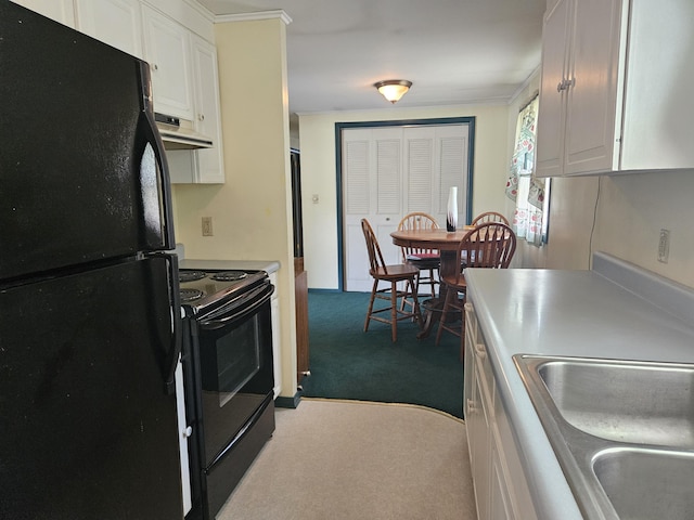 381 Birch St, Bangor, ME 04401 - kitchen featuring black appliances, carpet floors, ventilation hood, white cabinetry, and light countertops