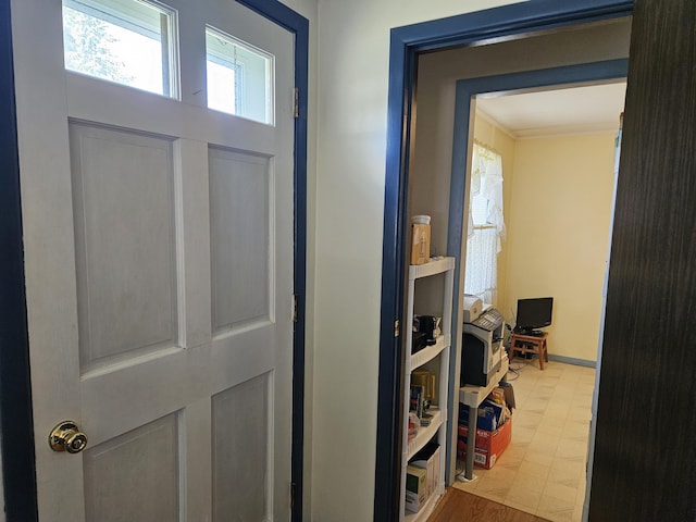 381 Birch St, Bangor, ME 04401 - hallway with tile patterned floors and crown molding