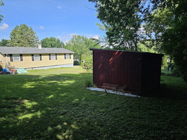 381 Birch St, Bangor, ME 04401 - view of grassy yard with a shed