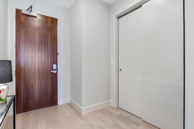 166 Fore St Unit 25, Portland, ME 04101 - entrance foyer with light wood finished floors and baseboards