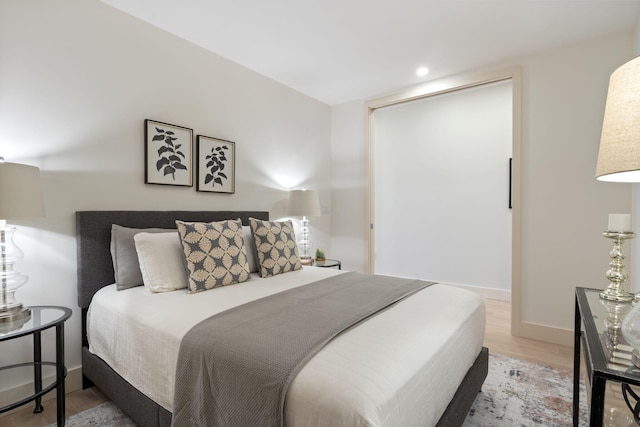 166 Fore St Unit 25, Portland, ME 04101 - bedroom with light wood finished floors and recessed lighting