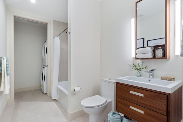 166 Fore St Unit 25, Portland, ME 04101 - bathroom with estacked washer and dryer, vanity, shower / bath combination with curtain, and tile patterned flooring