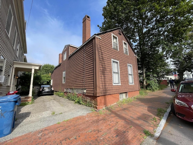 30 Dow St, Portland, ME 04102 - view of side of property with a chimney