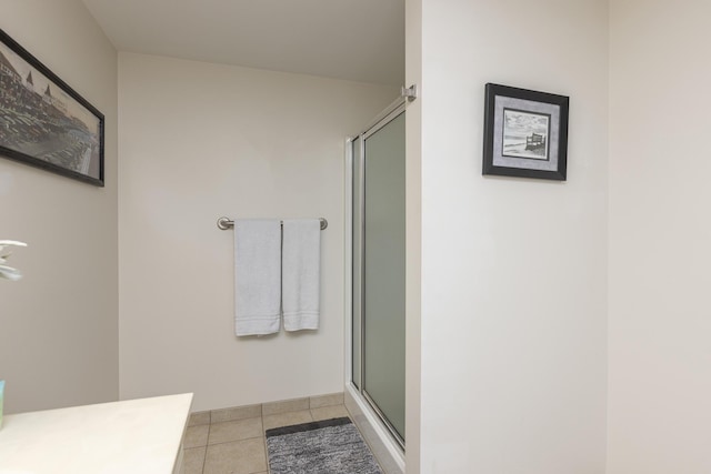1 E Grand Ave Unit 503, Old Orchard Beach, ME 04064 - full bathroom featuring a shower with shower door, tile patterned floors, and vanity