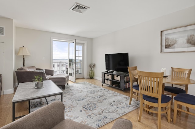 1 E Grand Ave Unit 503, Old Orchard Beach, ME 04064 - living room featuring wood finished floors and baseboards