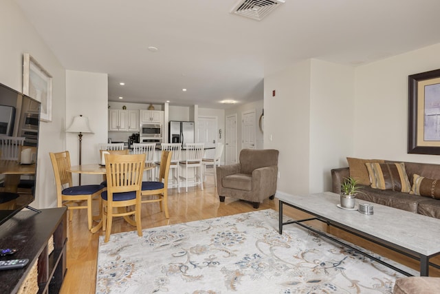1 E Grand Ave Unit 503, Old Orchard Beach, ME 04064 - living room featuring light wood-style floors and recessed lighting