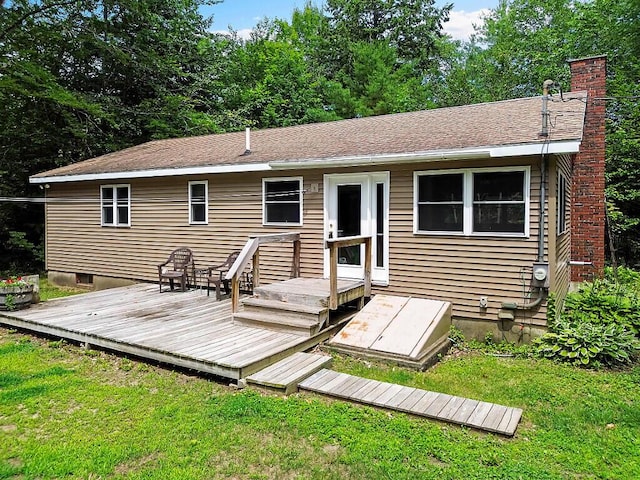 2672 N Belfast Ave, Augusta, ME 04330 - back of property with a chimney, a yard, and a wooden deck