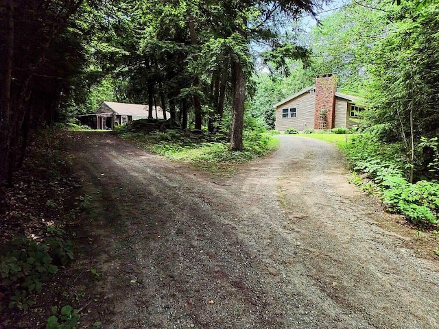 2672 N Belfast Ave, Augusta, ME 04330 - view of dirt / gravel driveway with a wooded view