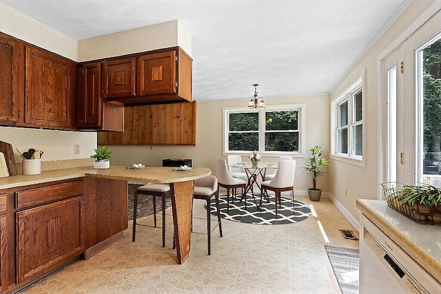 2672 N Belfast Ave, Augusta, ME 04330 - kitchen featuring light countertops and a chandelier