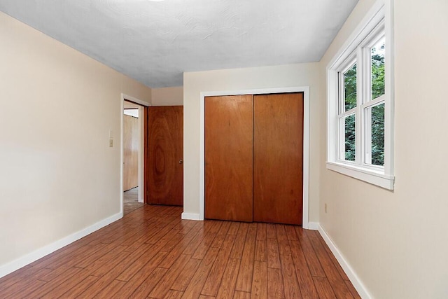 2672 N Belfast Ave, Augusta, ME 04330 - unfurnished bedroom with light wood-type flooring and a closet