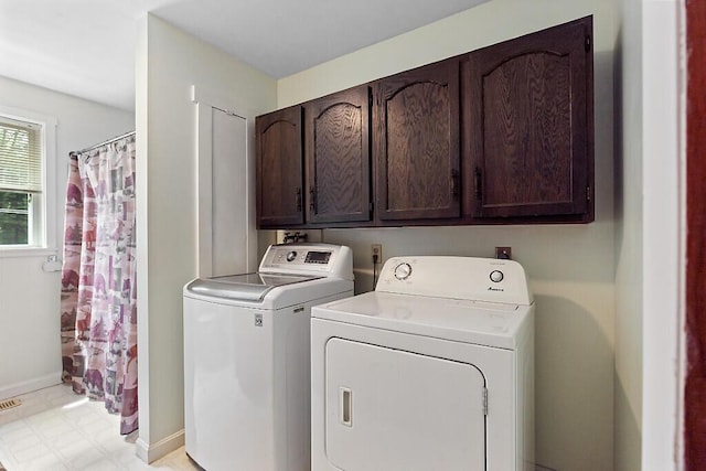 2672 N Belfast Ave, Augusta, ME 04330 - washroom with washer and dryer, cabinet space, and light floors