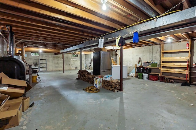 2672 N Belfast Ave, Augusta, ME 04330 - unfinished below grade area with freestanding refrigerator and oil tank