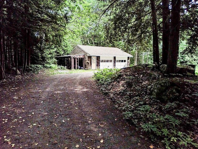 2672 N Belfast Ave, Augusta, ME 04330 - detached garage featuring a view of trees and driveway