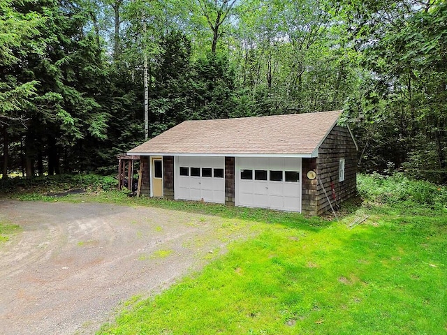2672 N Belfast Ave, Augusta, ME 04330 - detached garage featuring a view of trees