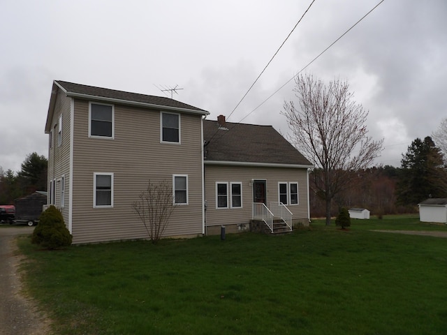 953 Pushaw Rd, Glenburn, ME 04401 - rear view of house featuring a lawn