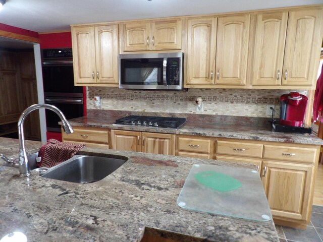 953 Pushaw Rd, Glenburn, ME 04401 - kitchen featuring appliances with stainless steel finishes, light brown cabinets, stone countertops, and backsplash