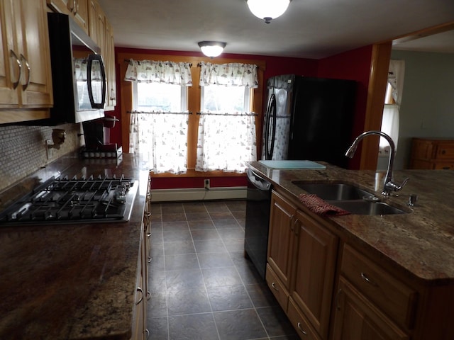 953 Pushaw Rd, Glenburn, ME 04401 - kitchen featuring black appliances, tasteful backsplash, a baseboard heating unit, dark stone counters, and dark tile patterned floors