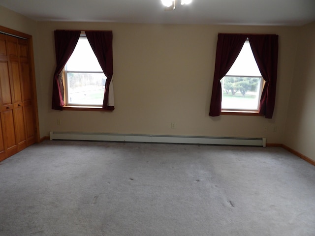 953 Pushaw Rd, Glenburn, ME 04401 - unfurnished bedroom featuring a baseboard radiator, carpet floors, and a closet
