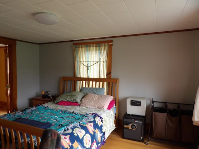 953 Pushaw Rd, Glenburn, ME 04401 - bedroom with ornamental molding and light wood-type flooring