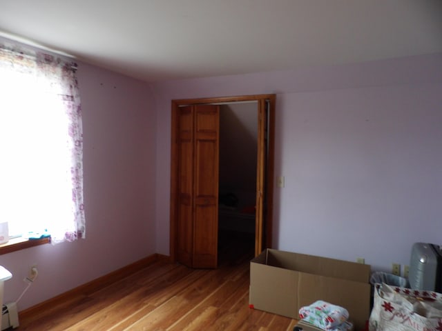 953 Pushaw Rd, Glenburn, ME 04401 - bedroom with light wood-style flooring and baseboard heating